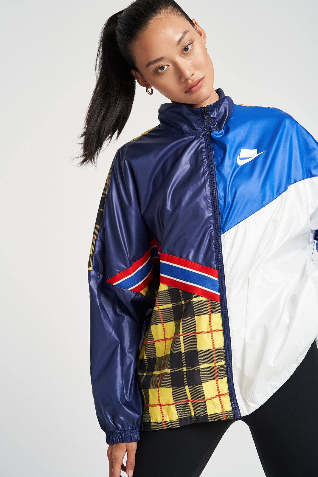 Fashion model standing in a blue color-block jacket