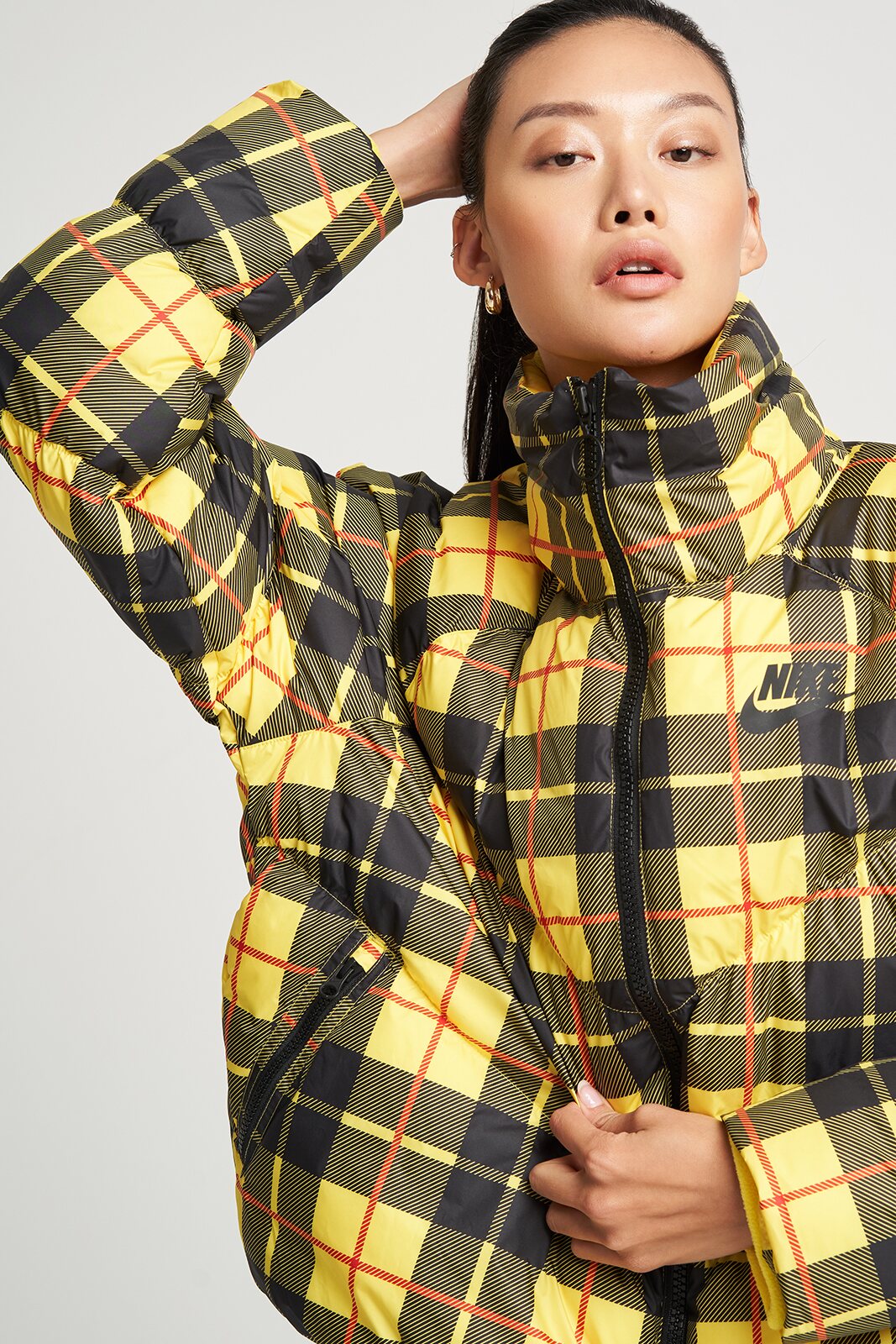 Close editorial portrait in a yellow plaid jacket